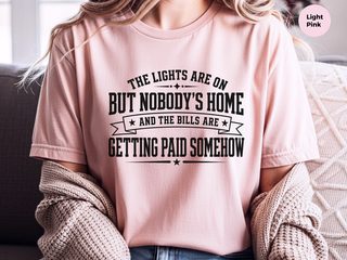 The Lights Are On But Nobody's Home…and The Bills Are Getting Paid Somehow funny shirt - photo 7